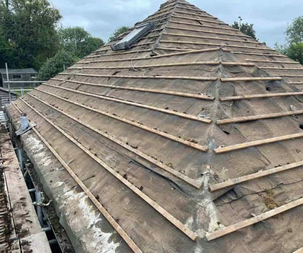 This is a photo of a hip roof that has been stripped back to the battens, and is awaiting a new roof covering to be installed. Works carried out by ES Roofing Adwick Le Street